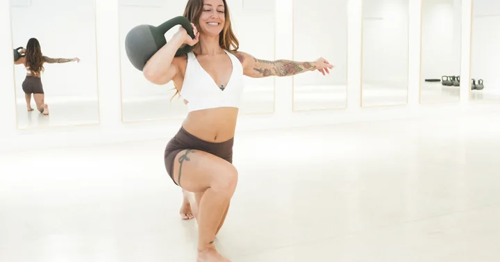 A student moving with a kettlebell in the GRO NORA studio